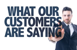 Business man pointing the text What Our Customers Are Saying-3
