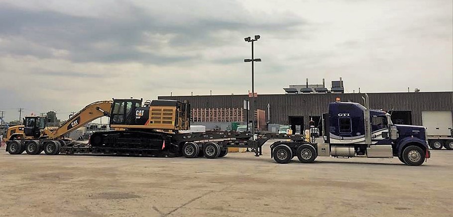 Excavator transport by truck